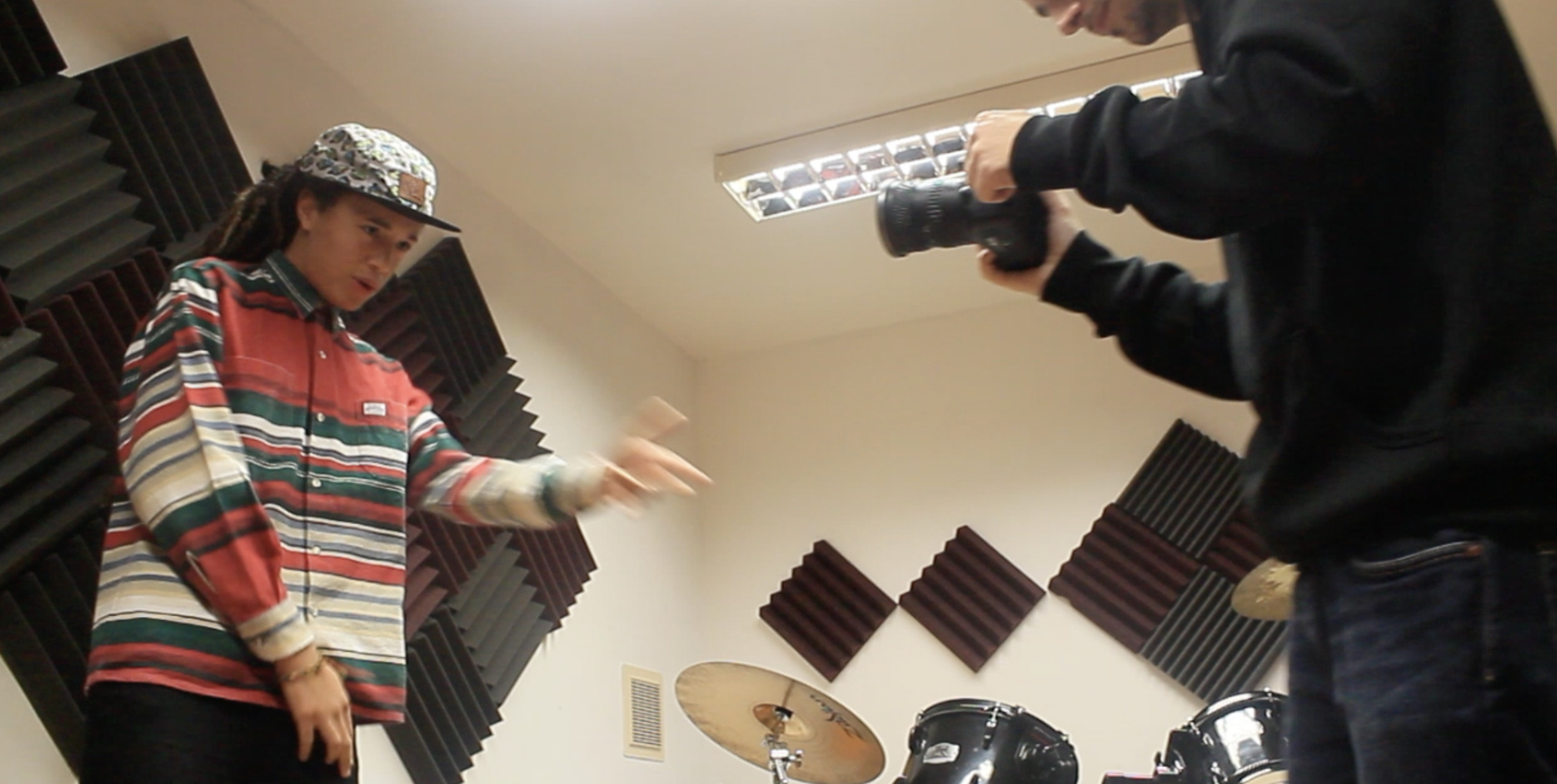 Isaiah Dreads recording a freestyle at Youth Club Studio in Dorchester.
