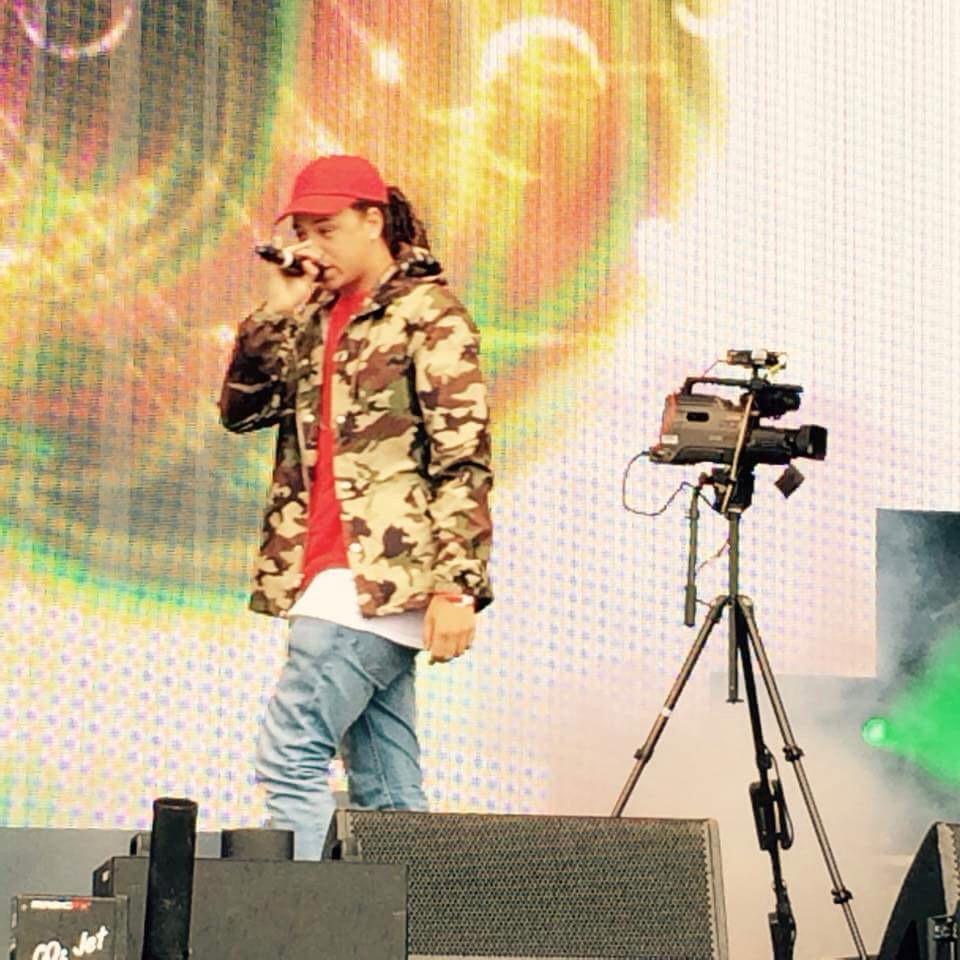 Isaiah Dreads performing at a festival.
