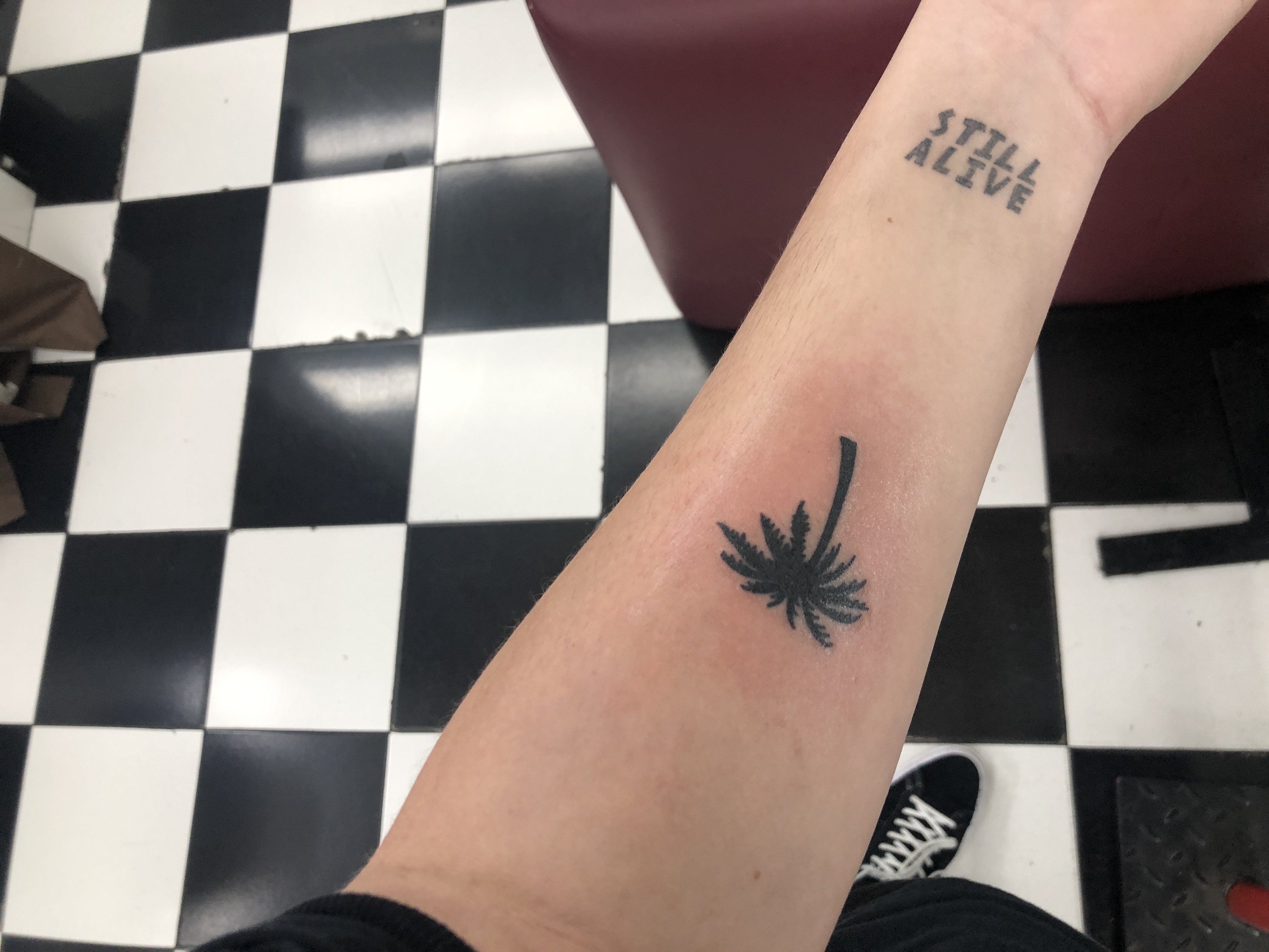 Isaiah Dreads' 'Still Alive' tattoo.
